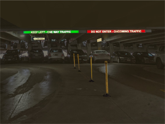 overhead illuminated signs show direction of travel in green colour. Red signs display do-not-enter